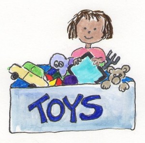 child taking iPad out of toy chest