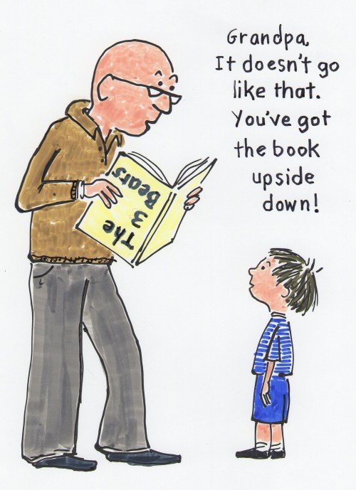 child telling grandpa he is holding the book upside down.
