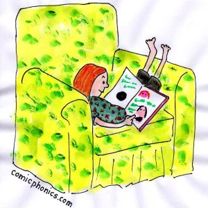 red headed girl in easy chair reading