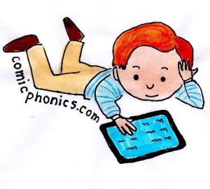 Boy on floor reading an ebook on his tablet.