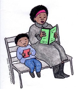 Son and mother reading on a park bench.