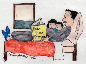 Dad reading to children in bed